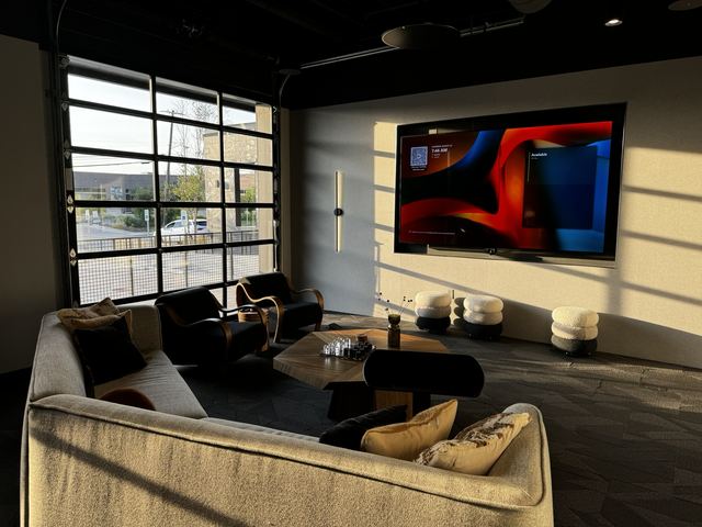 Lounge with wall display and scheduling panel
