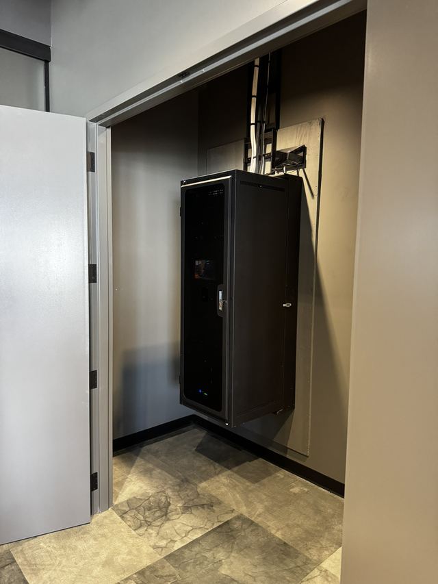 Wall-mounted equipment enclosure